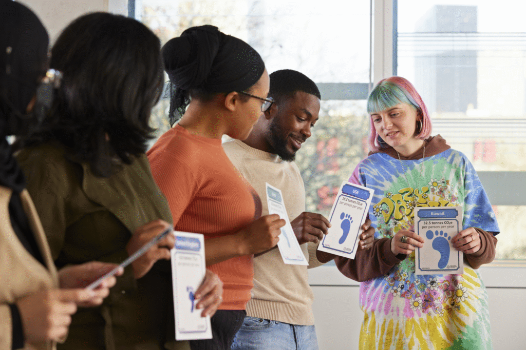 Group of students in a row holding posters